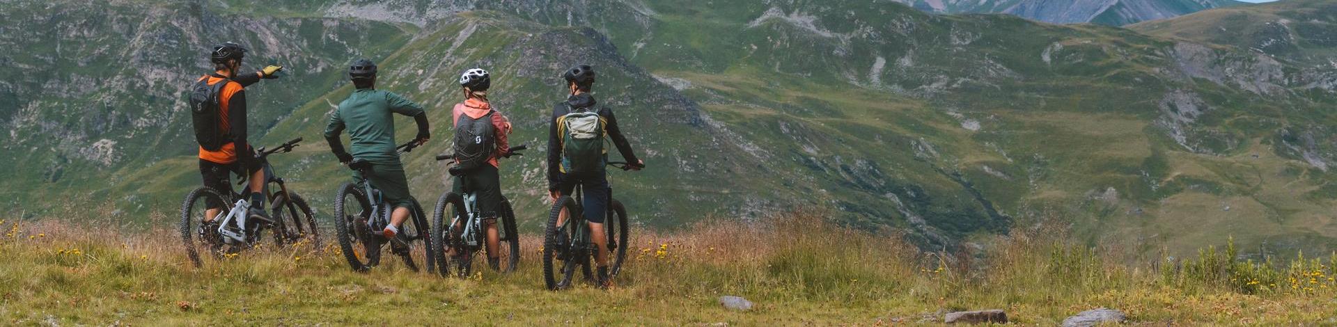 Cyclists on electric mountain bikes on a mountain trail in the 3 Valleys